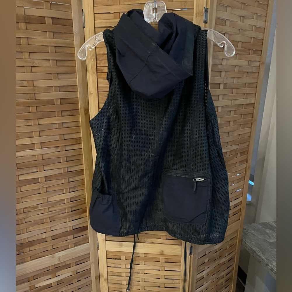 Leather perforated vest with pocket details on front and back